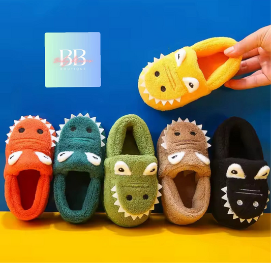 Colorful children's slippers with shark design on a blue and yellow background