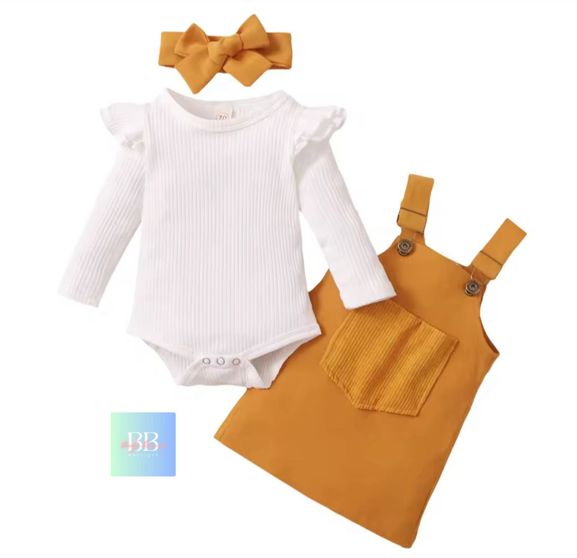 Baby outfit set with white bodysuit, mustard yellow overalls, and headband on a white background.