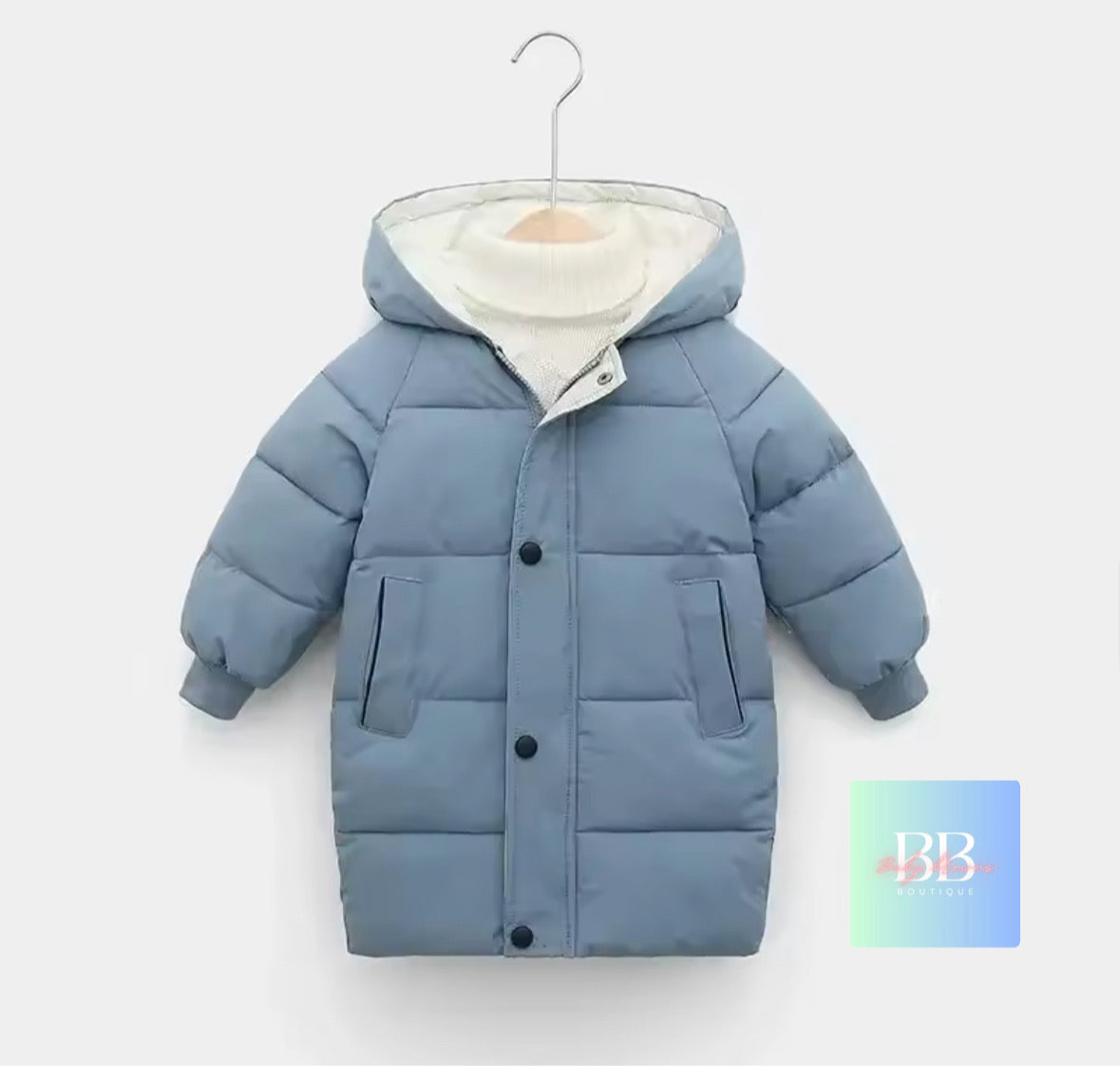 Blue children's puffer jacket on a hanger with a white background