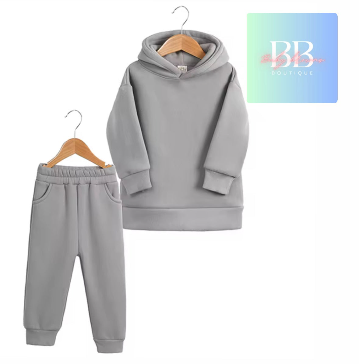 Gray hoodie and pants set on hangers with BB Boutique logo.
