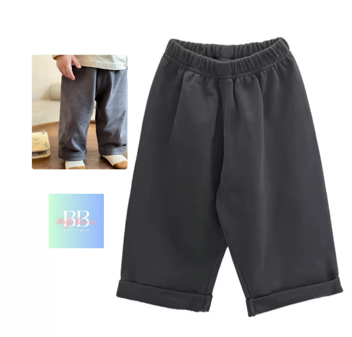 Dark gray pants with an inset showing a person wearing them, and a brand logo at the bottom.