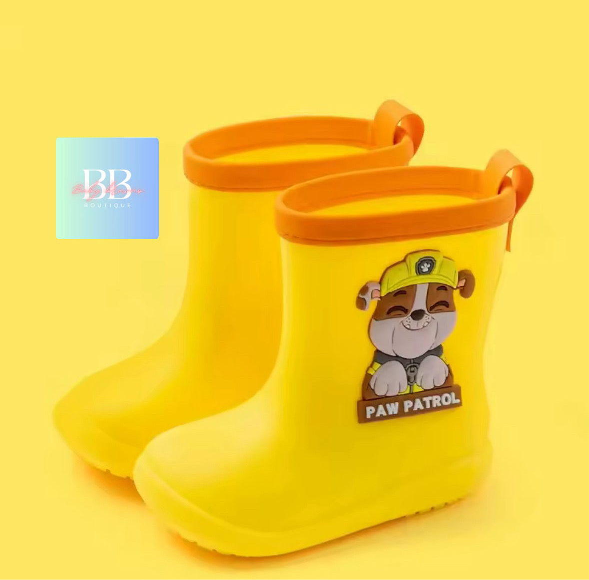 Yellow rain boots with a cartoon character on a yellow background