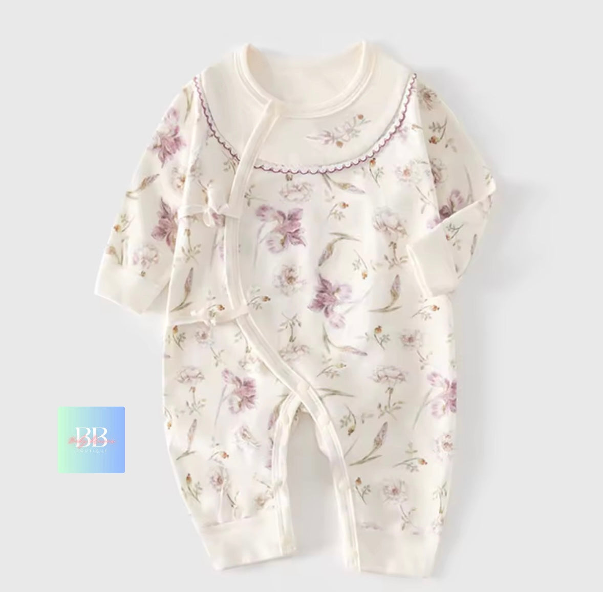 Floral-patterned baby onesie on a white background