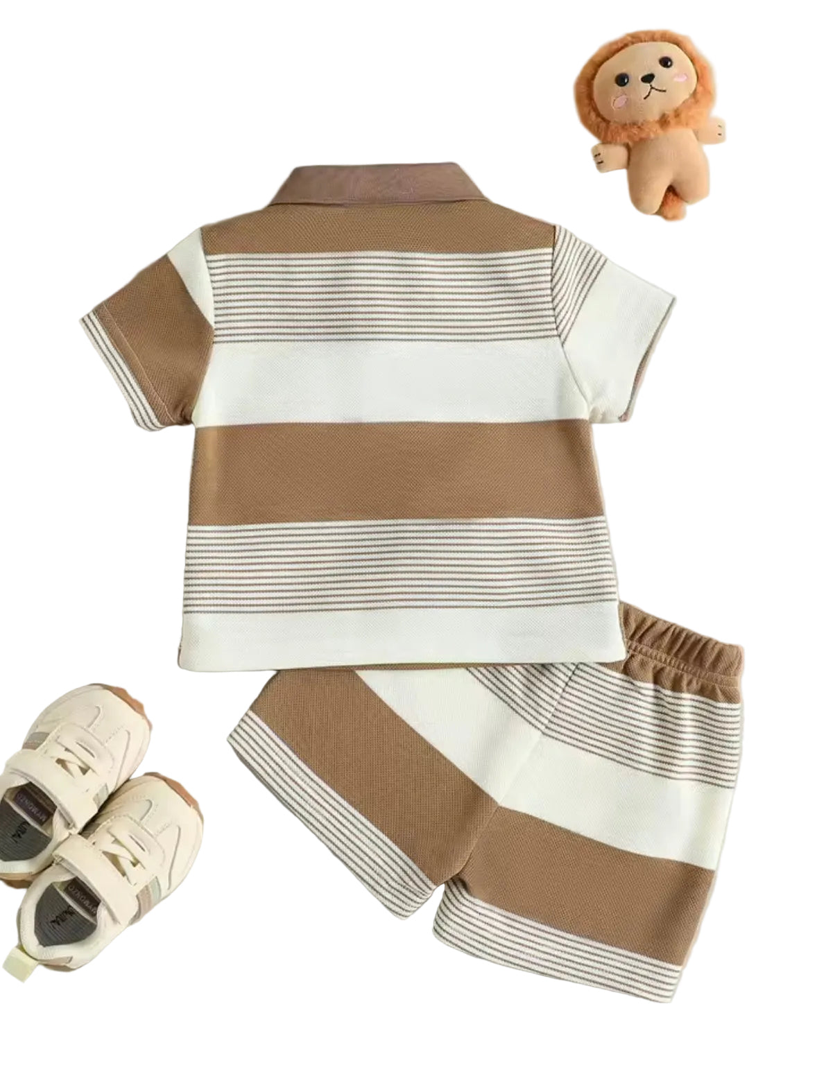Children's brown and white striped outfit with shoes and a toy lion on a light gray background