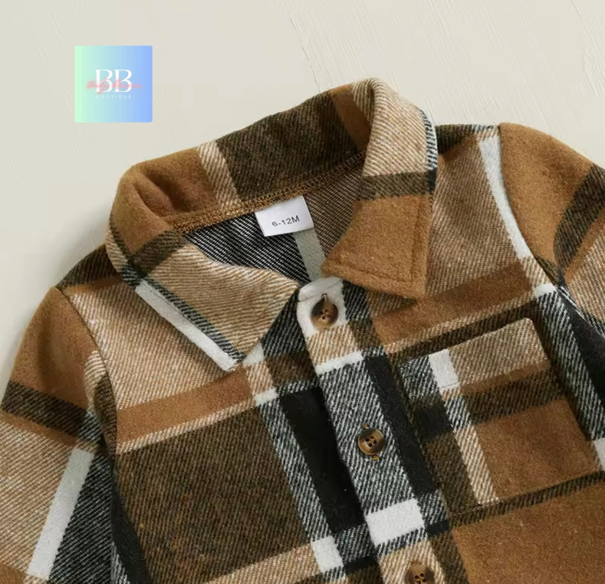 Plaid jacket with a visible brand logo on a light background