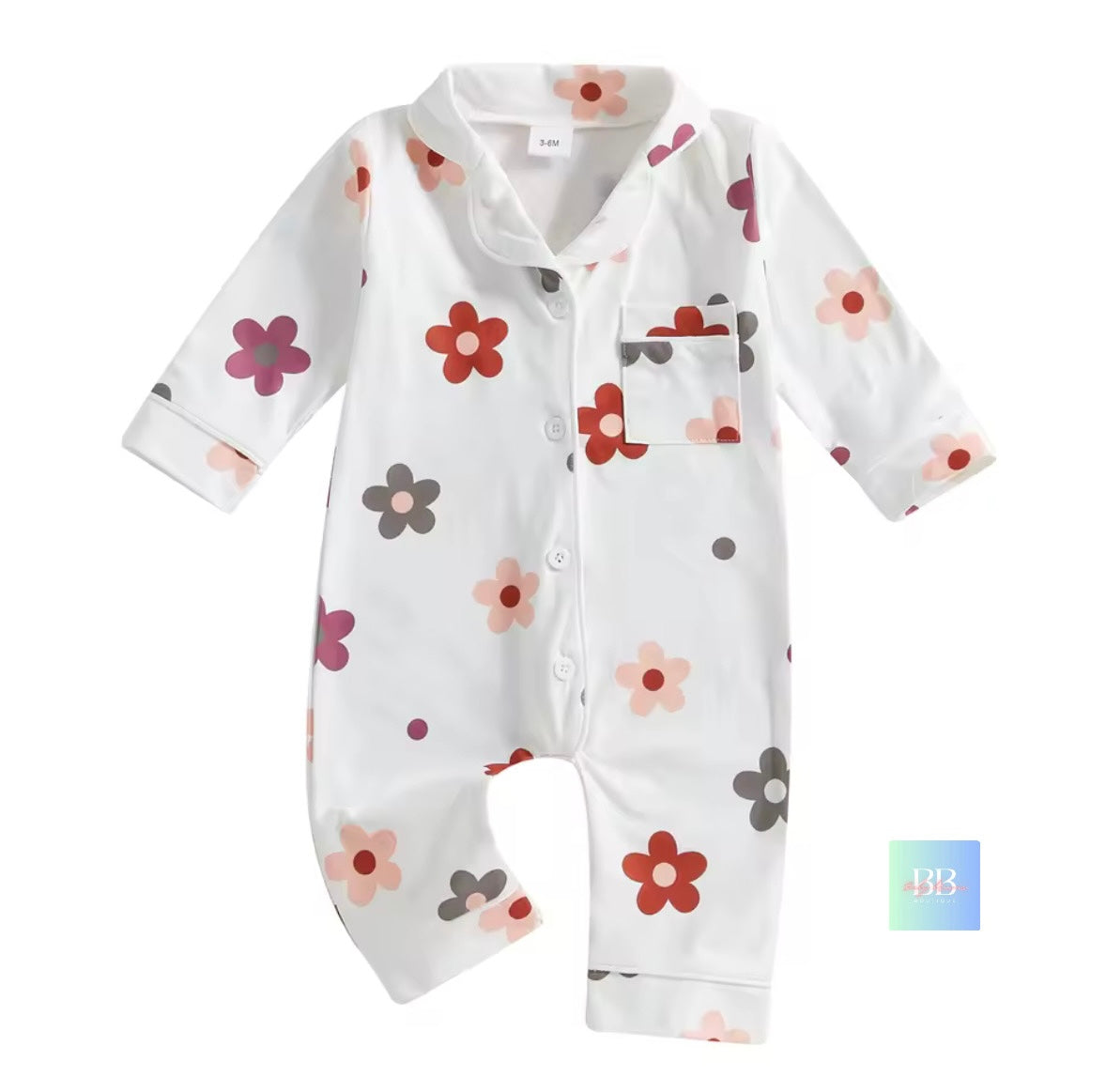 White baby romper with colorful floral patterns on a white background