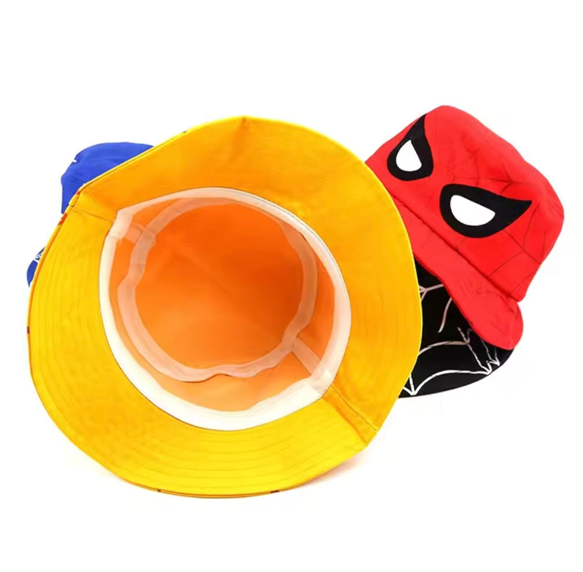 Yellow bucket hat with orange interior and red Spider-Man mask hat on a white background