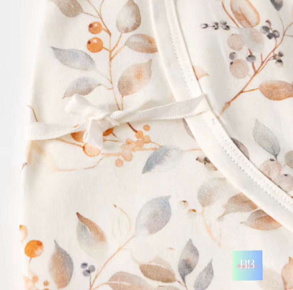 Floral-patterned fabric with a white border on a light background