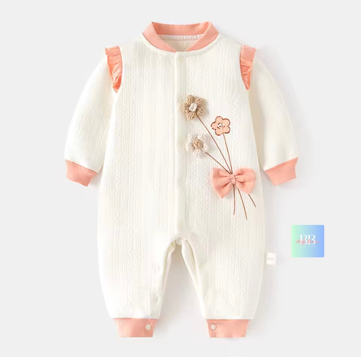 Baby romper with floral design on a white background