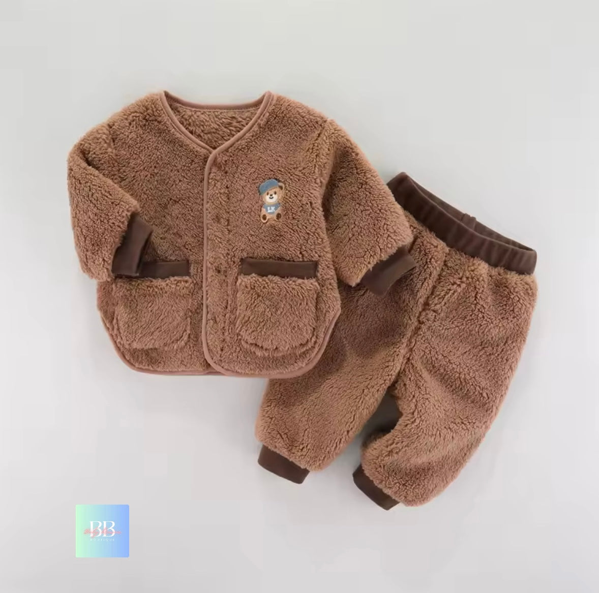 Brown children's fleece jacket and pants set on a light gray background