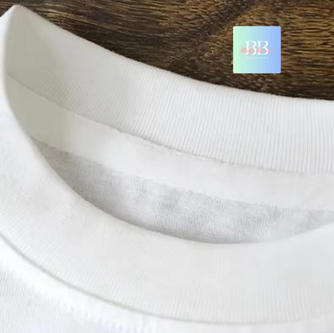 Close-up of white fabric with a brand logo in the corner