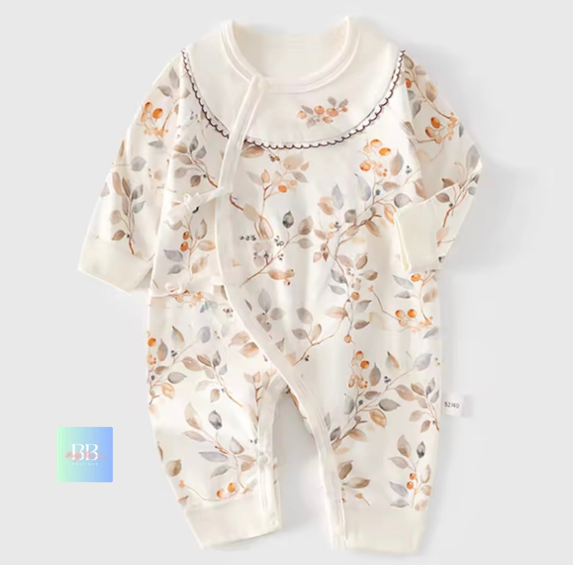 Baby onesie with floral pattern on a light gray background
