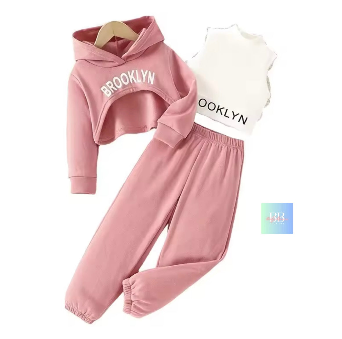 Pink hoodie, white shirt, and pink pants with 'Brooklyn' text on a white background