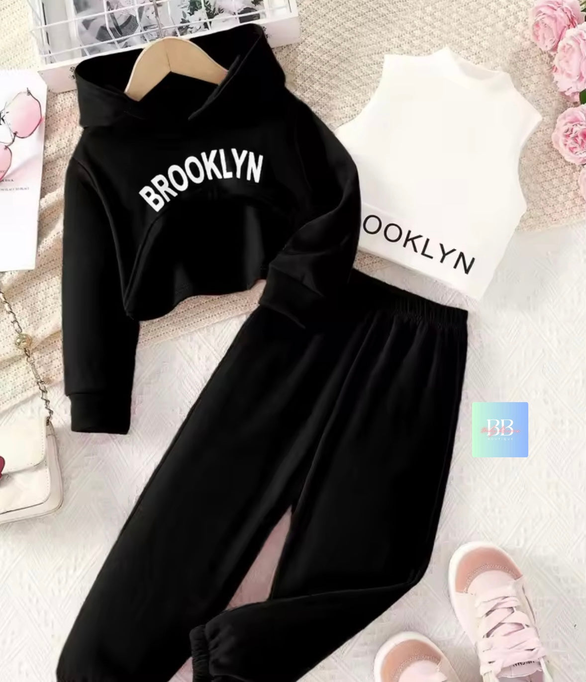 Black hoodie and pants set with 'Brooklyn' text on a light background