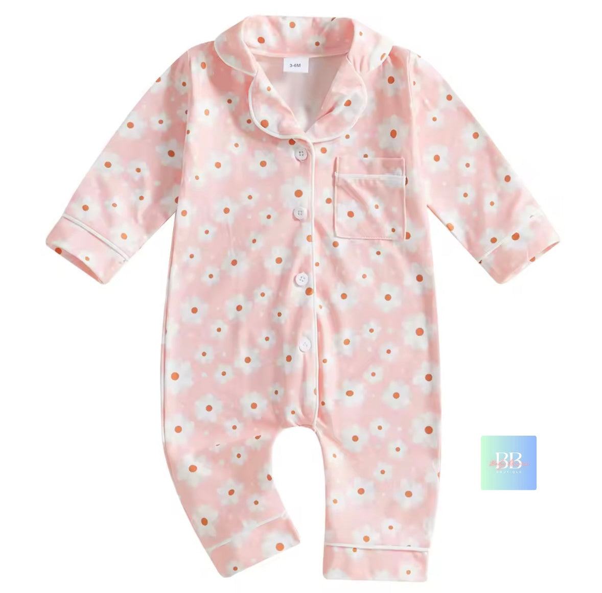 Pink baby onesie with white floral pattern on a white background