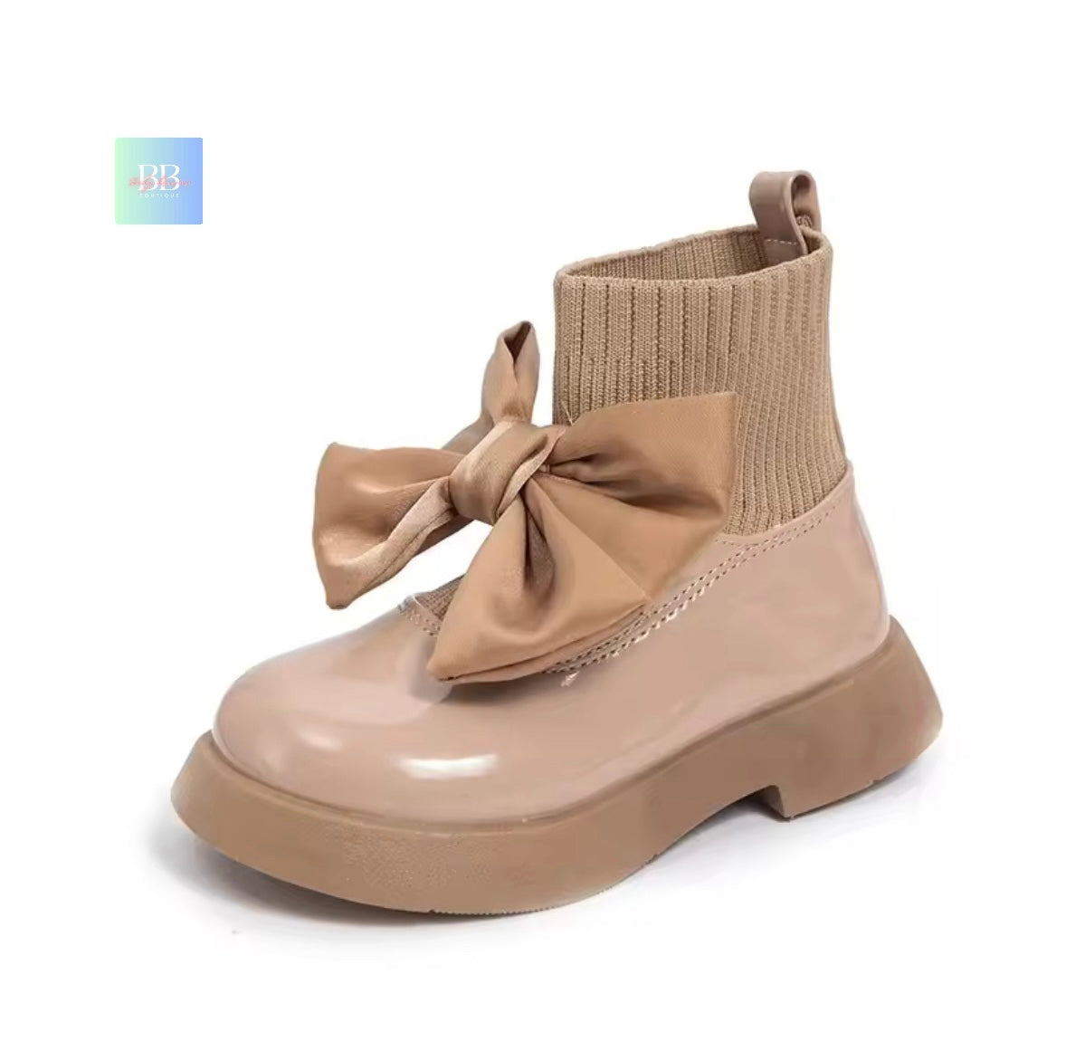 Beige boot with a large bow on a white background