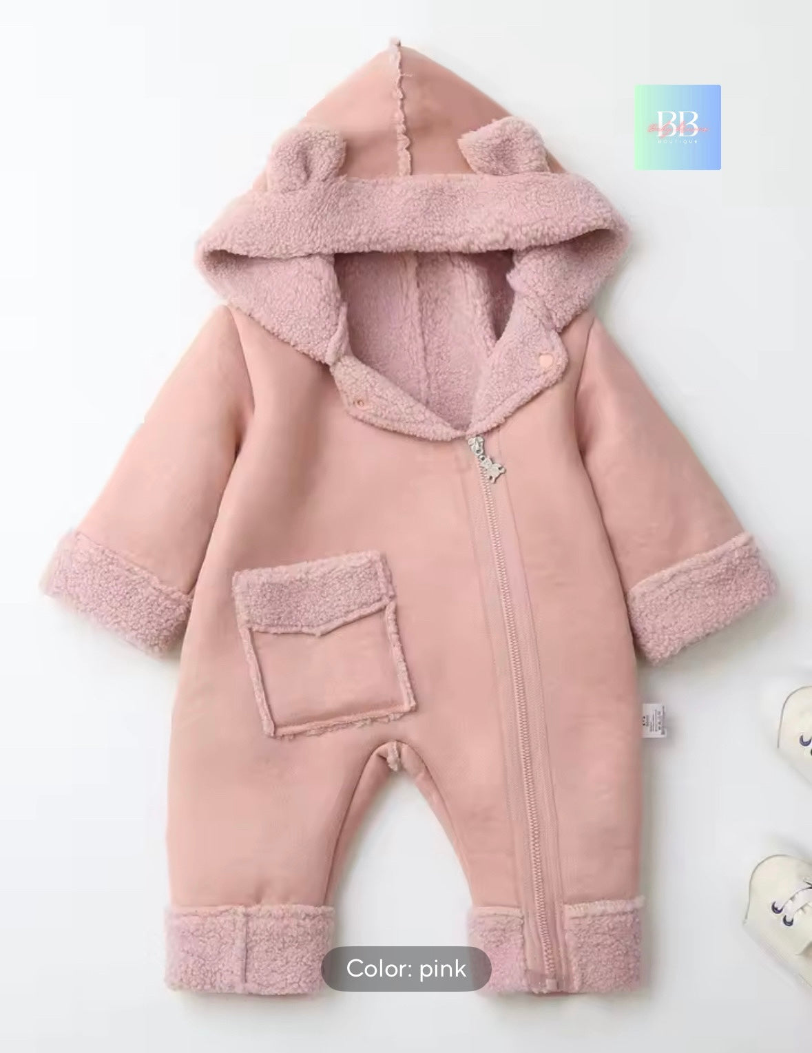 Pink baby snowsuit with hood on a white background