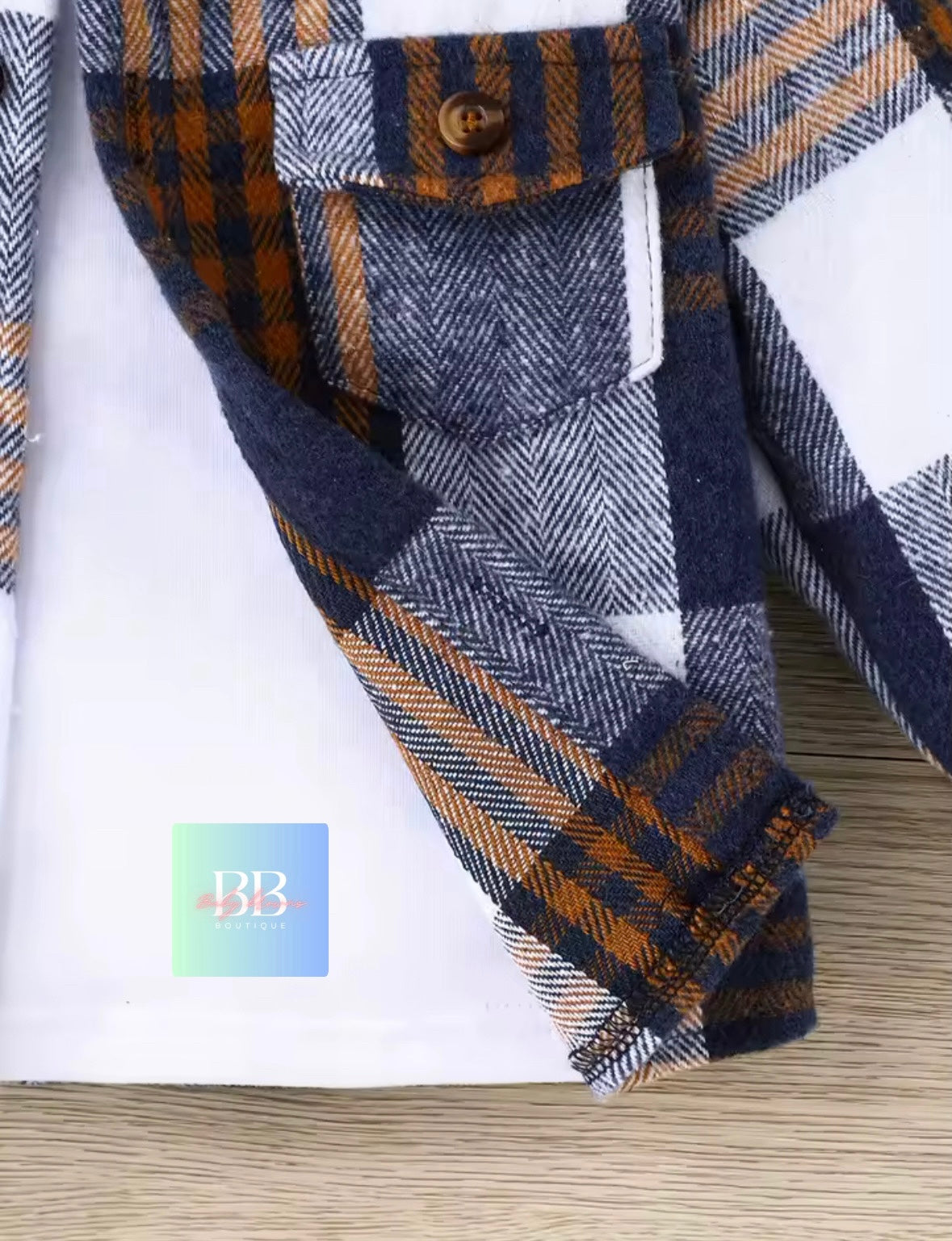 Plaid shirt with rolled-up sleeves on a white background