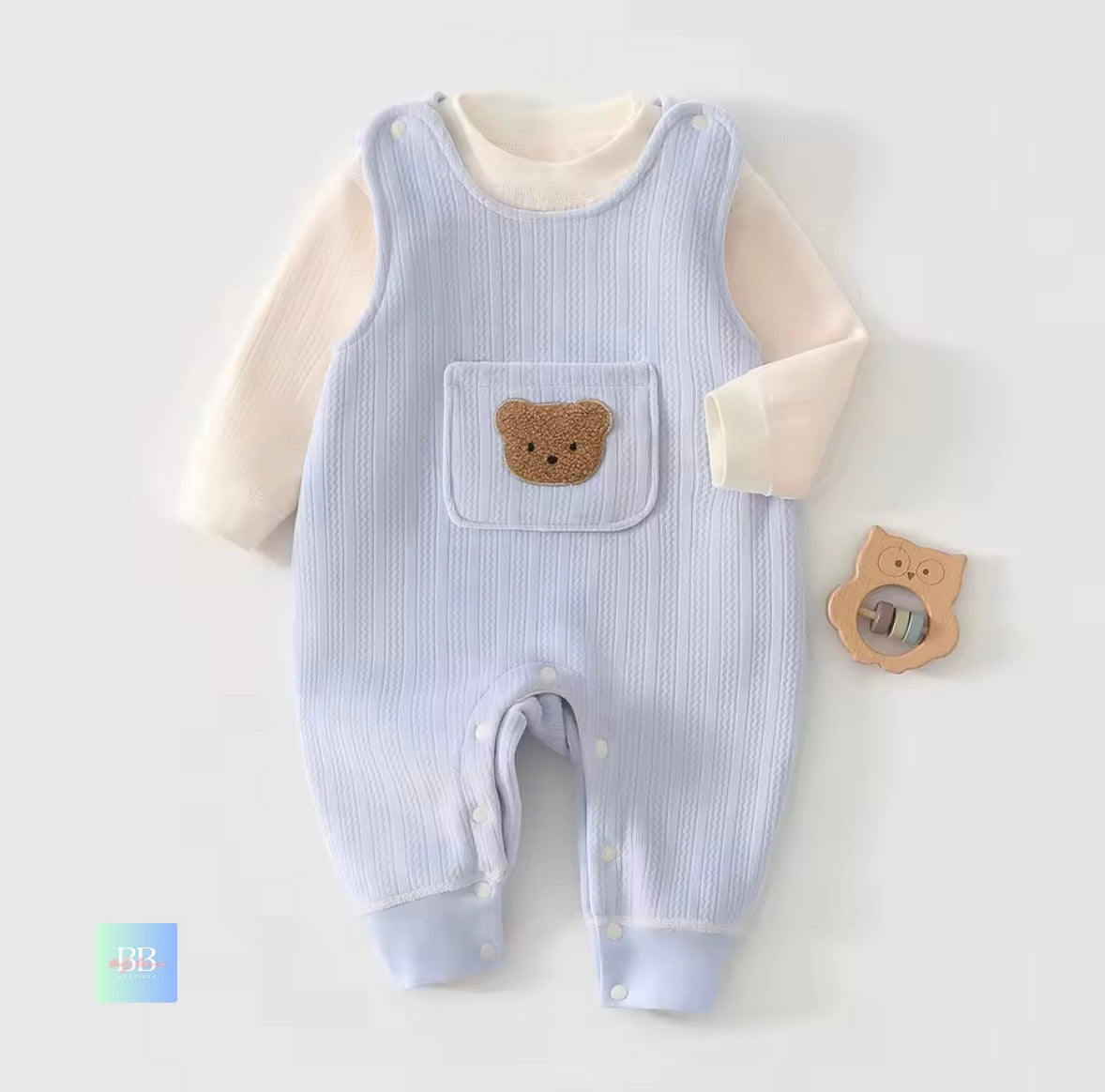 Baby romper with bear design on a light gray background
