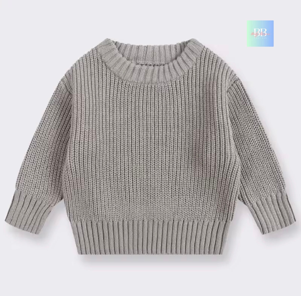 Gray knitted sweater on a light gray background