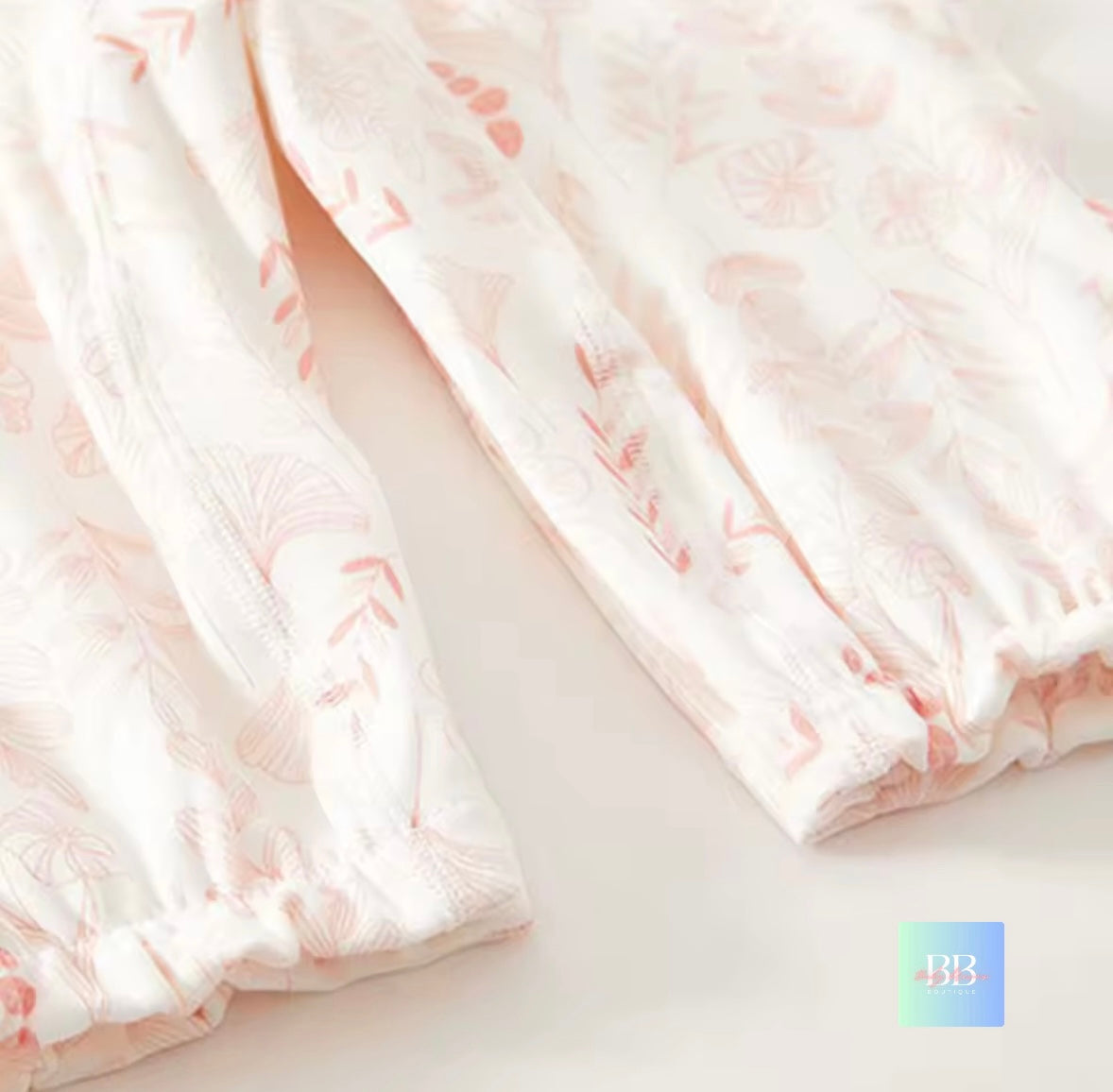 Light pink fabric with subtle pattern on a white background