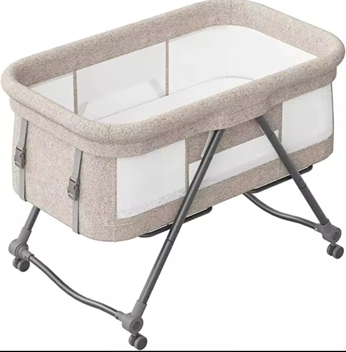 Portable baby crib with beige fabric and white interior on a white background