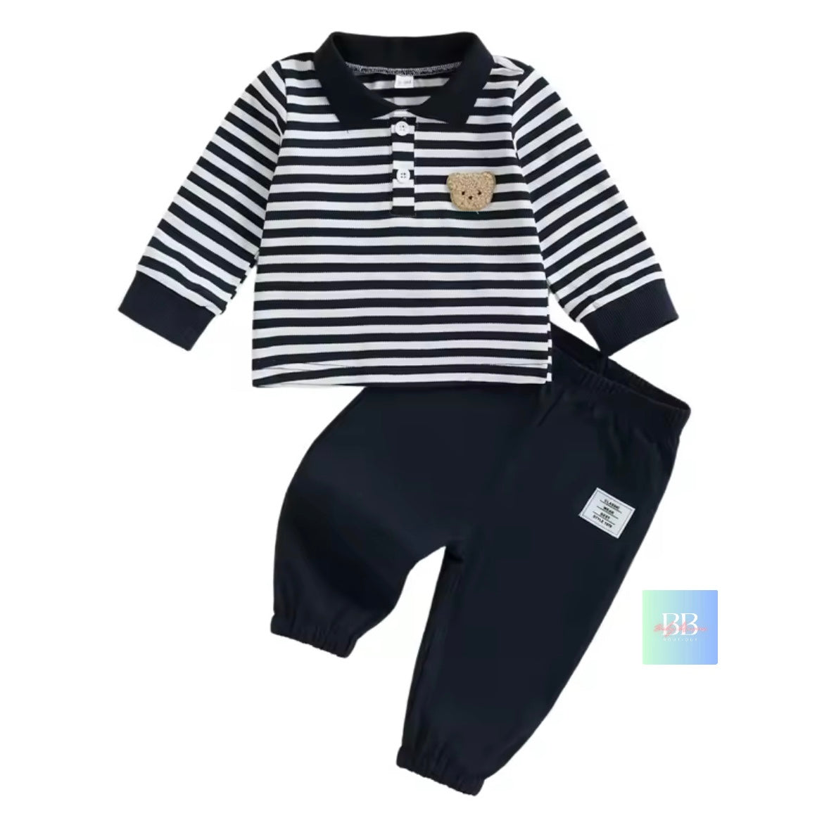 Children's outfit with striped shirt and black pants on a white background