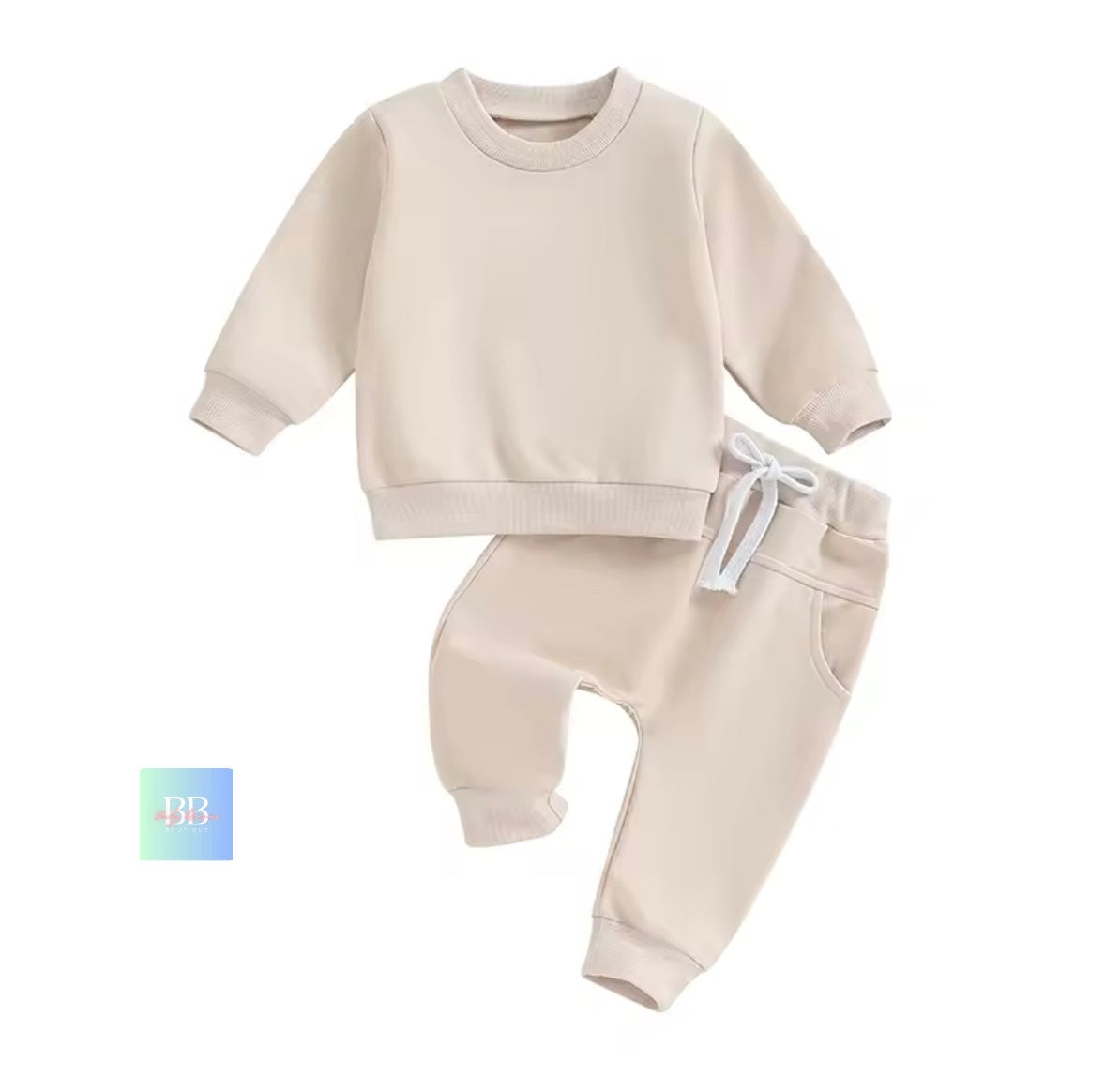 Beige baby sweatshirt and pants set on a white background