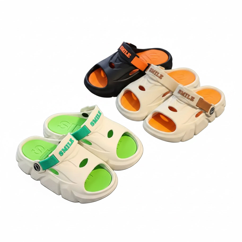 Two pairs of sandals with green and orange soles on a gray surface.