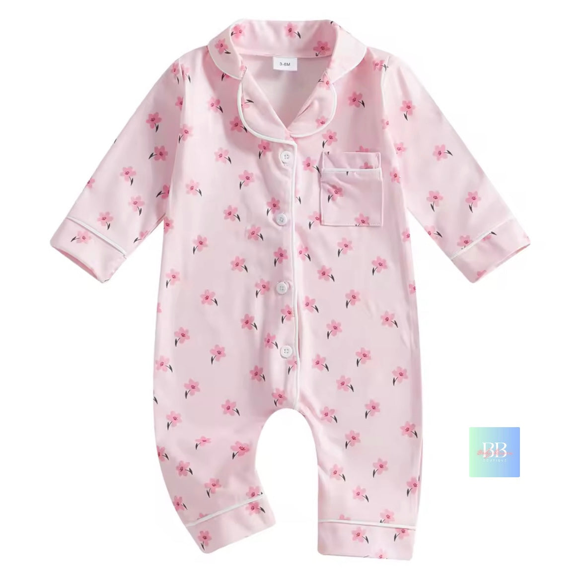 Pink baby onesie with floral pattern on a white background