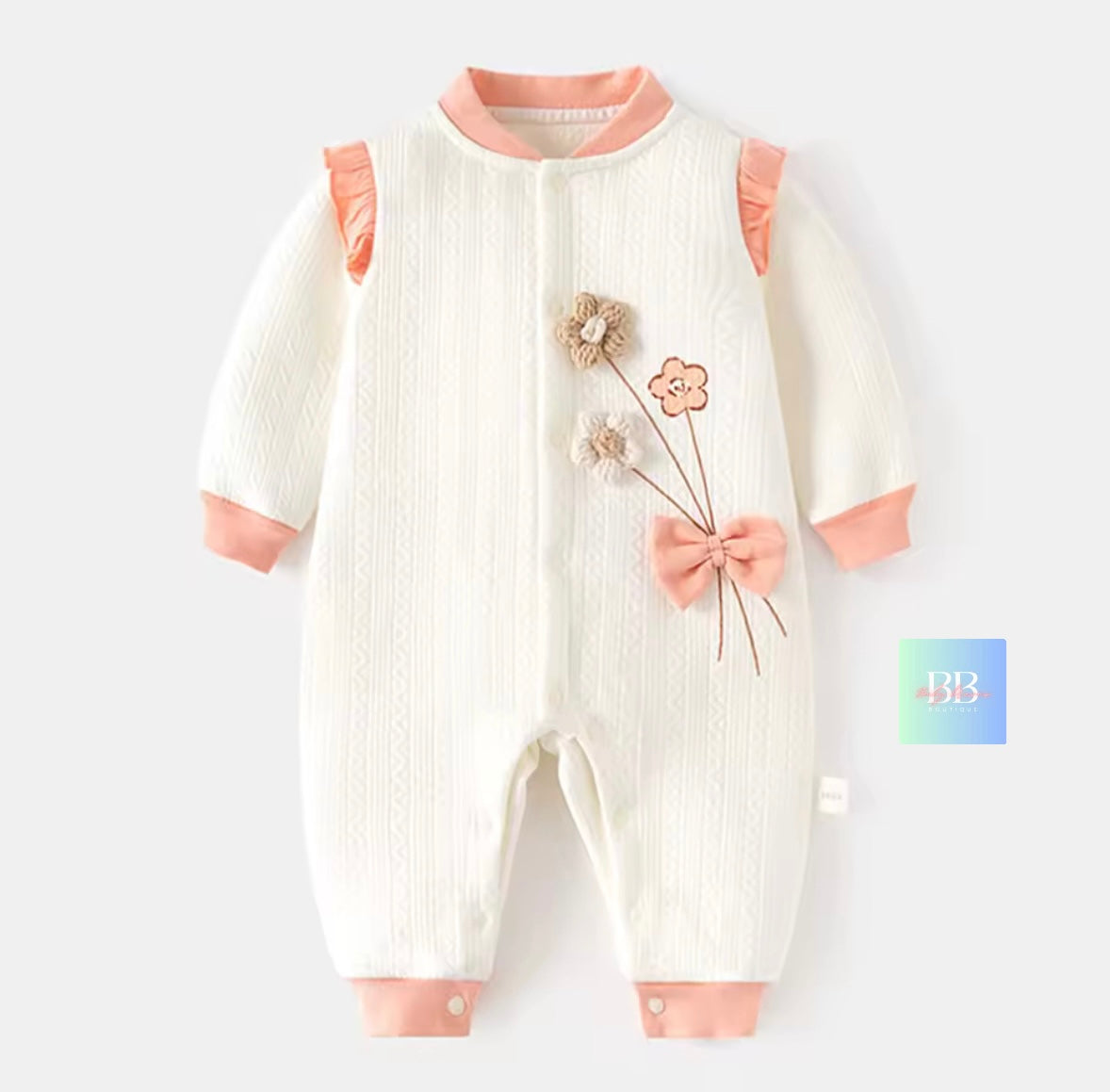 Baby romper with floral design on a white background