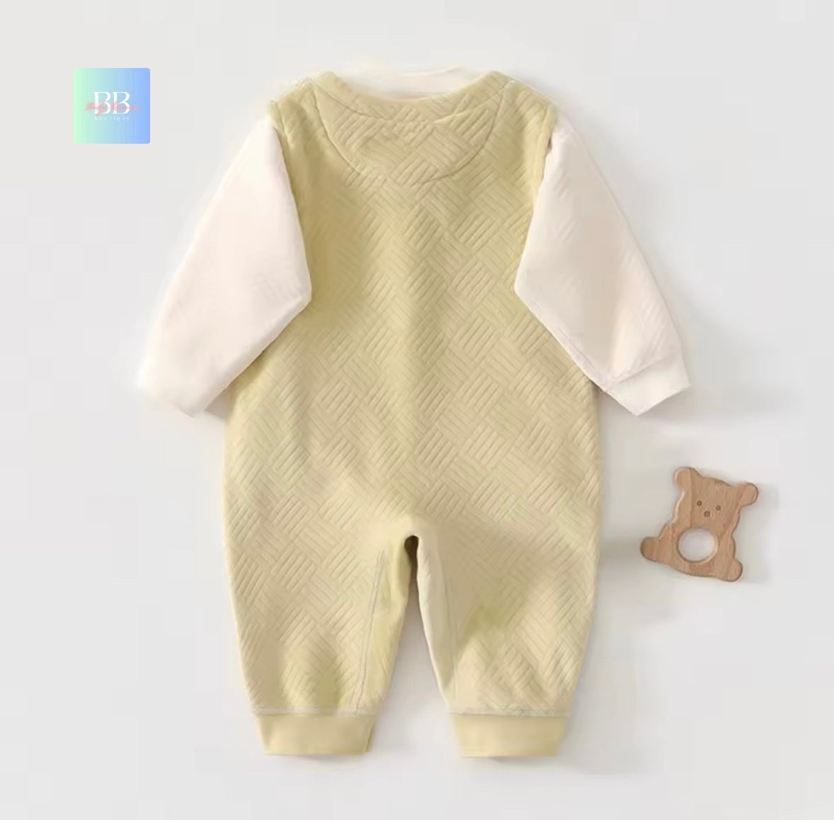 Baby romper with textured pattern on a white background