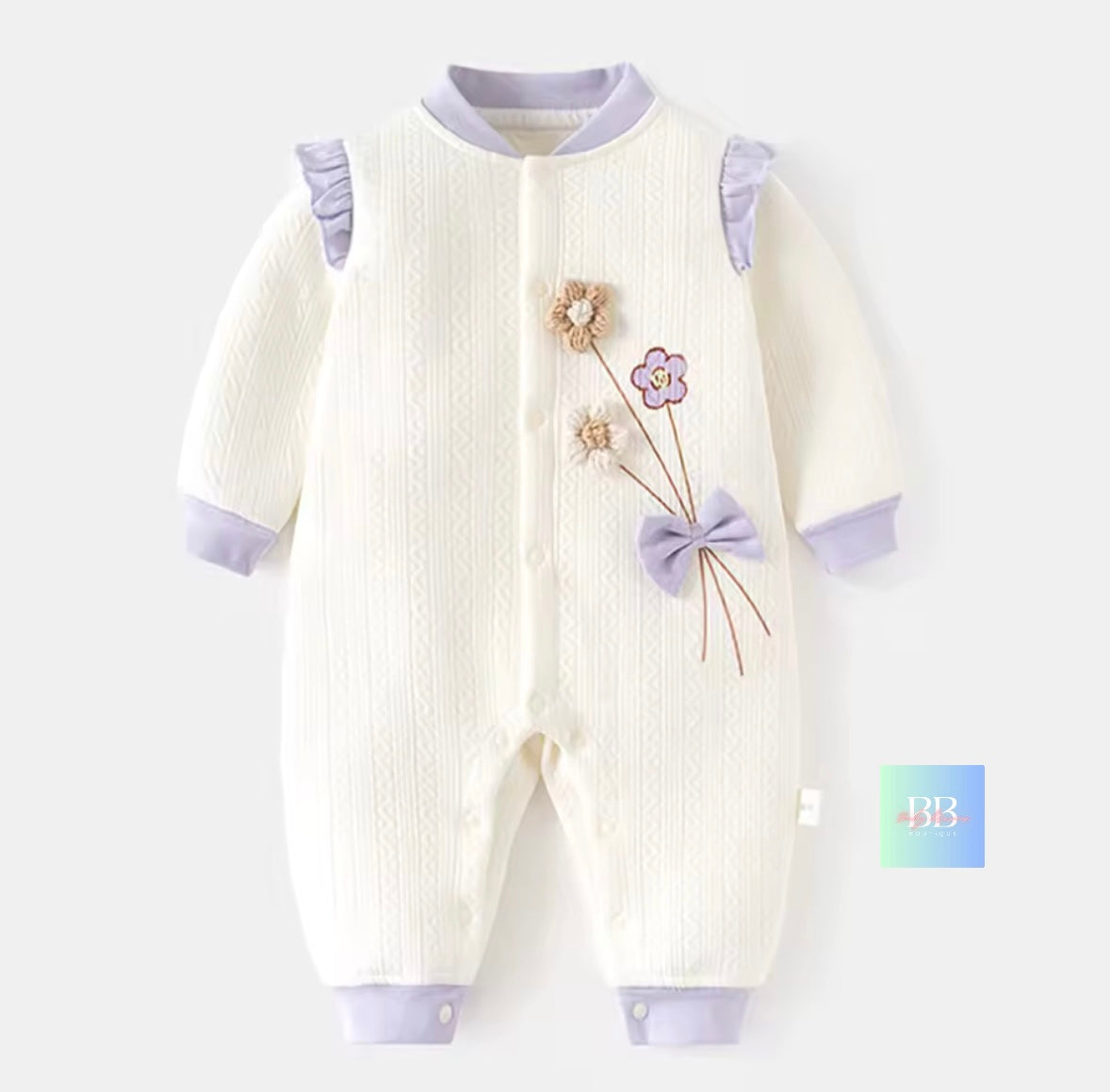 Baby onesie with floral design on a white background