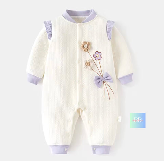 Baby onesie with floral design on a white background