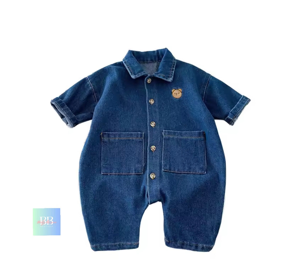 Blue denim baby romper with bear emblem on a white background