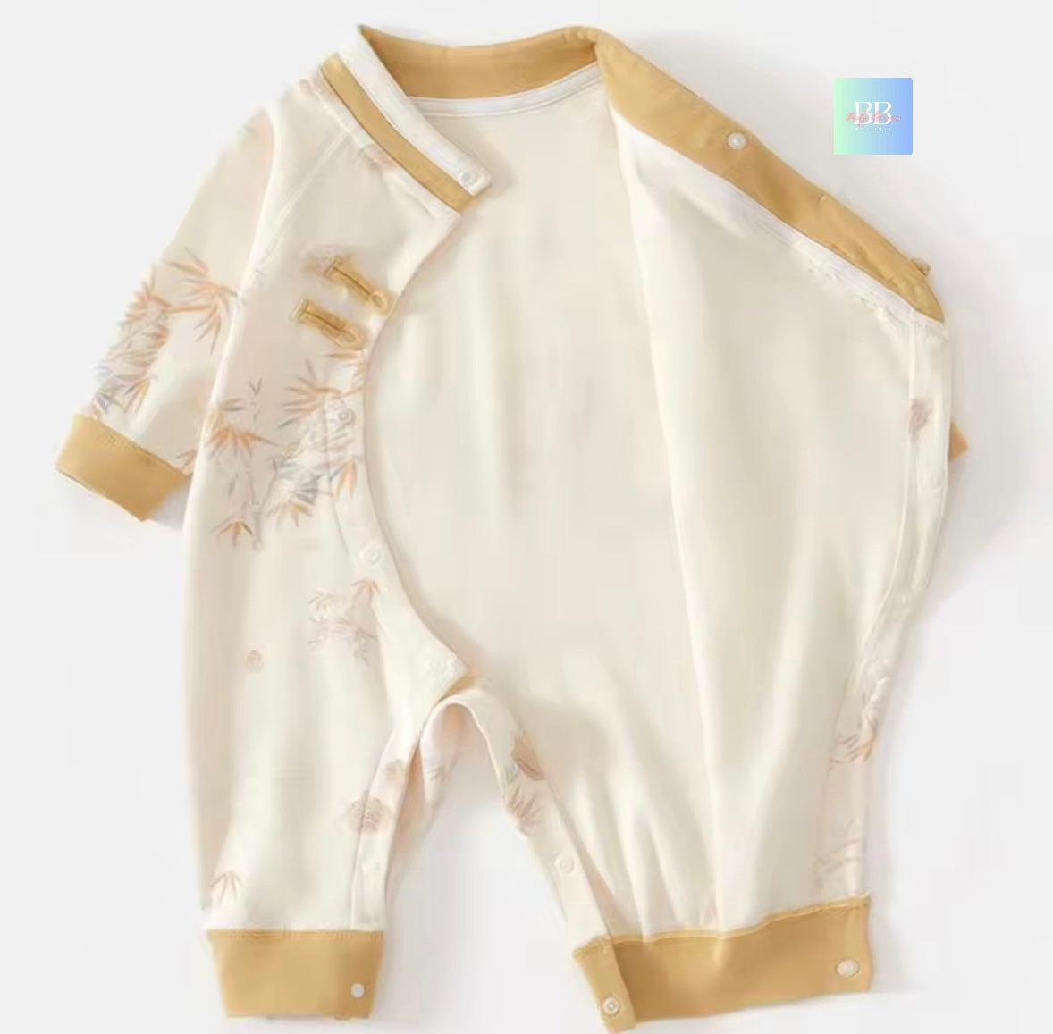 Baby romper with beige accents on a white background