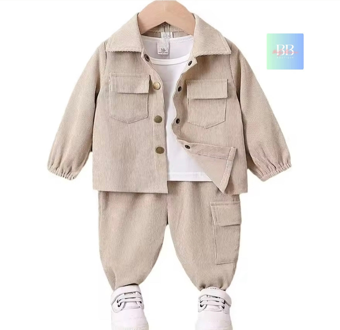 Children's beige jacket and pants set on a white background