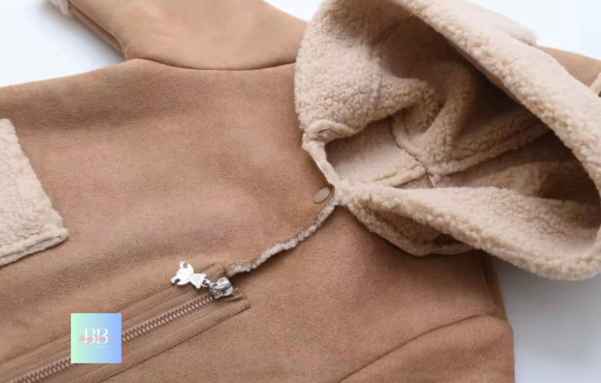 Close-up of a brown fleece jacket with a zipper on a white background