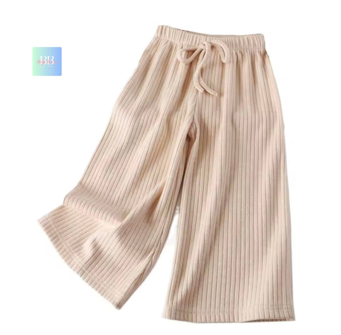Beige ribbed knit pants with a drawstring on a white background