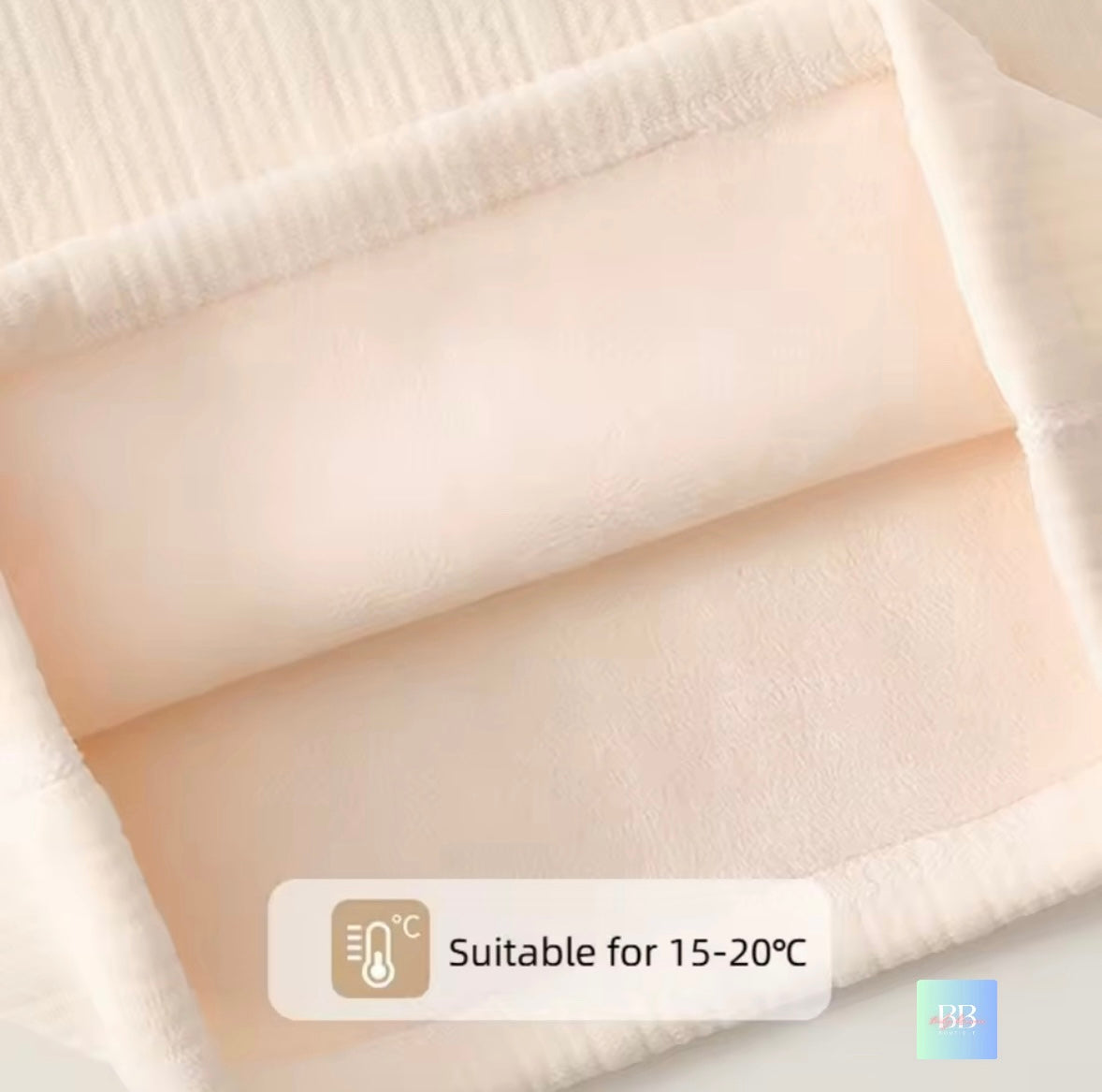 Close-up of a beige fabric with a temperature suitability label indicating 15-20°C.