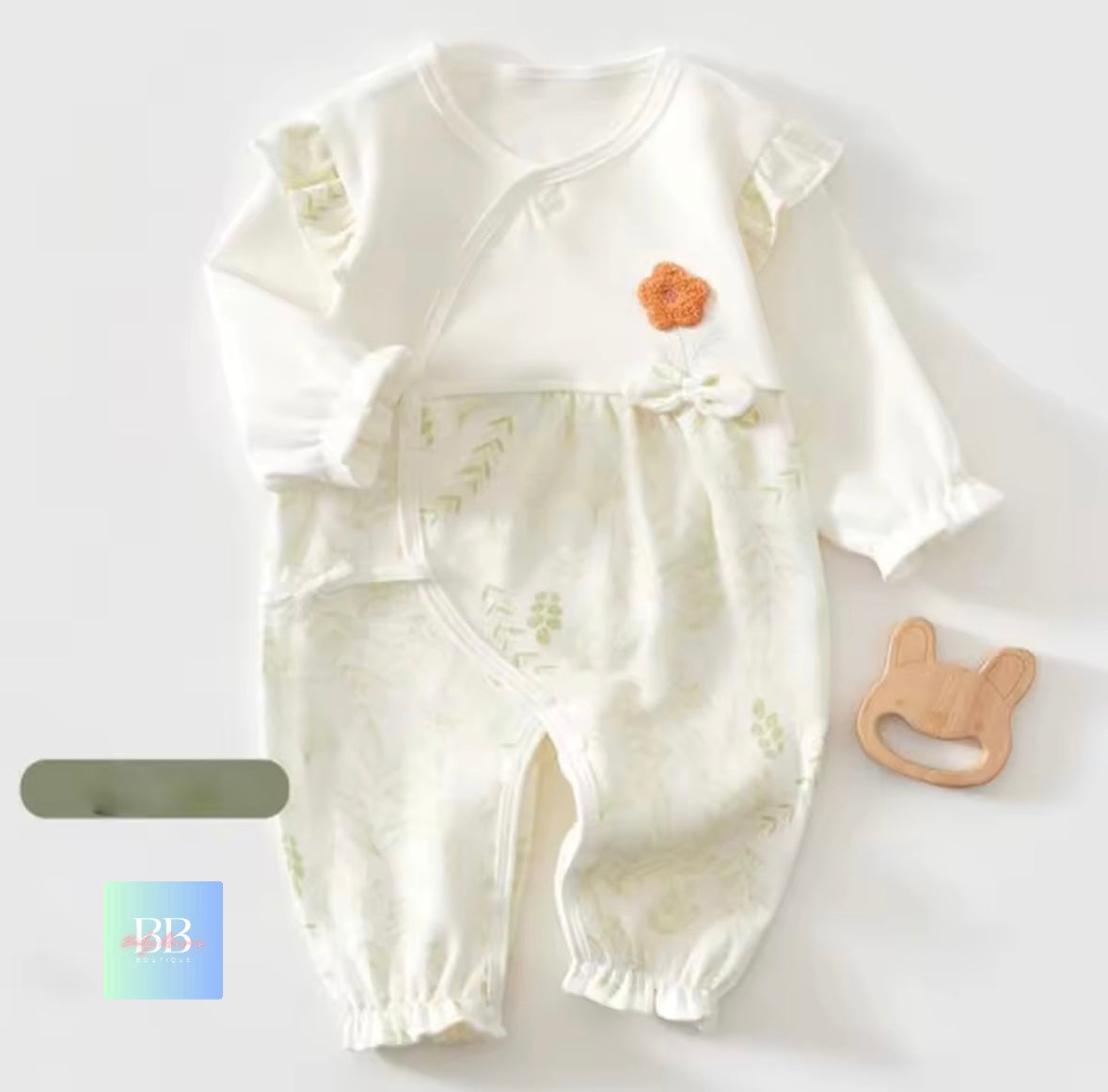 Baby romper with floral design on a white background