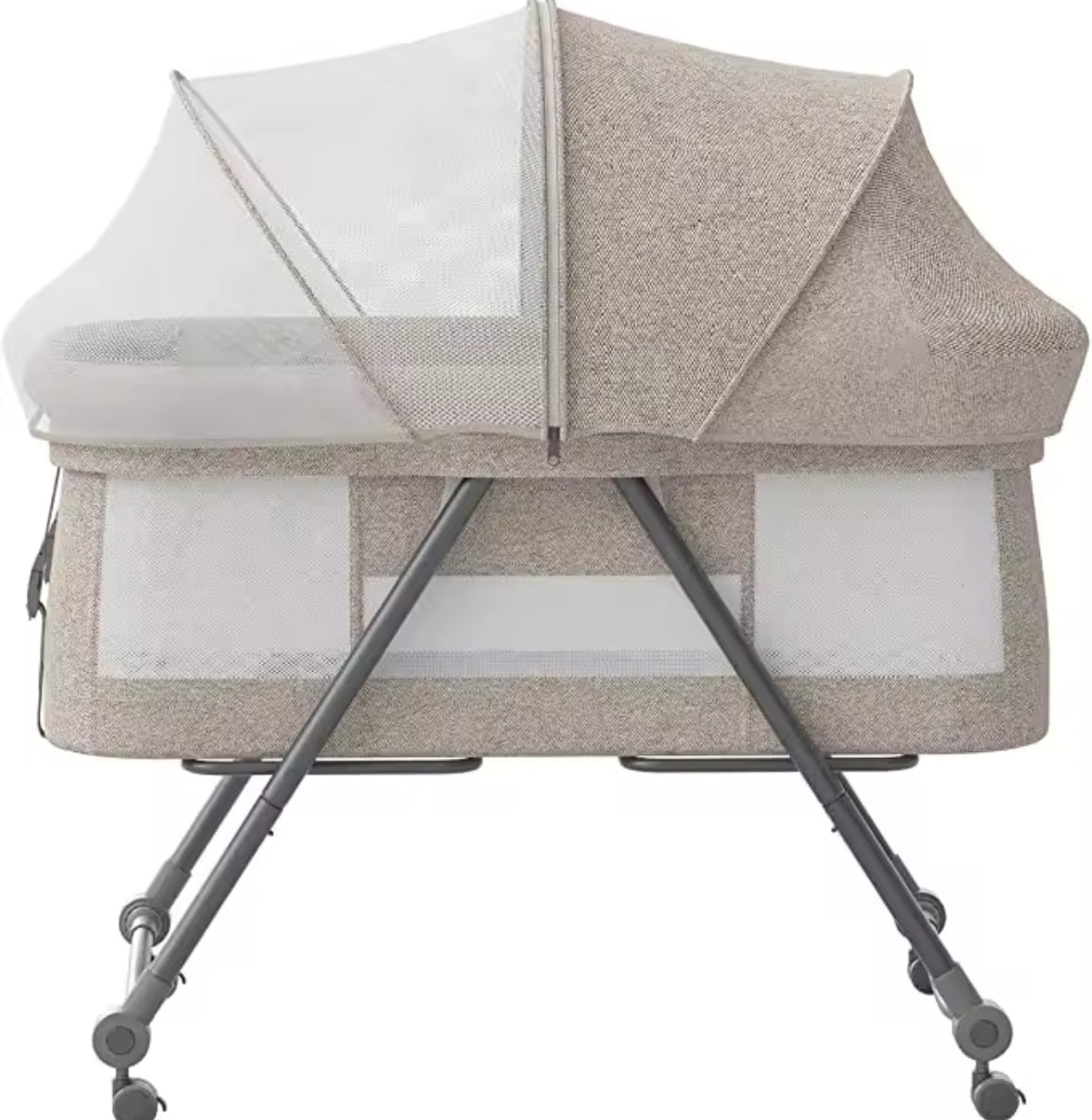 Beige baby crib with canopy on a white background