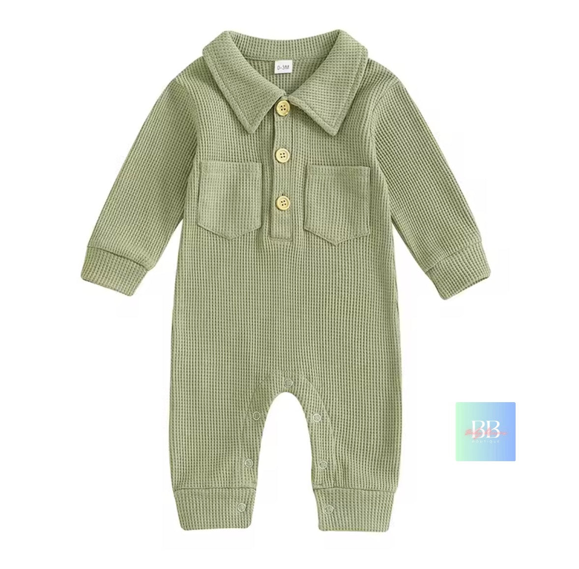 Green checkered baby romper with button details on a white background