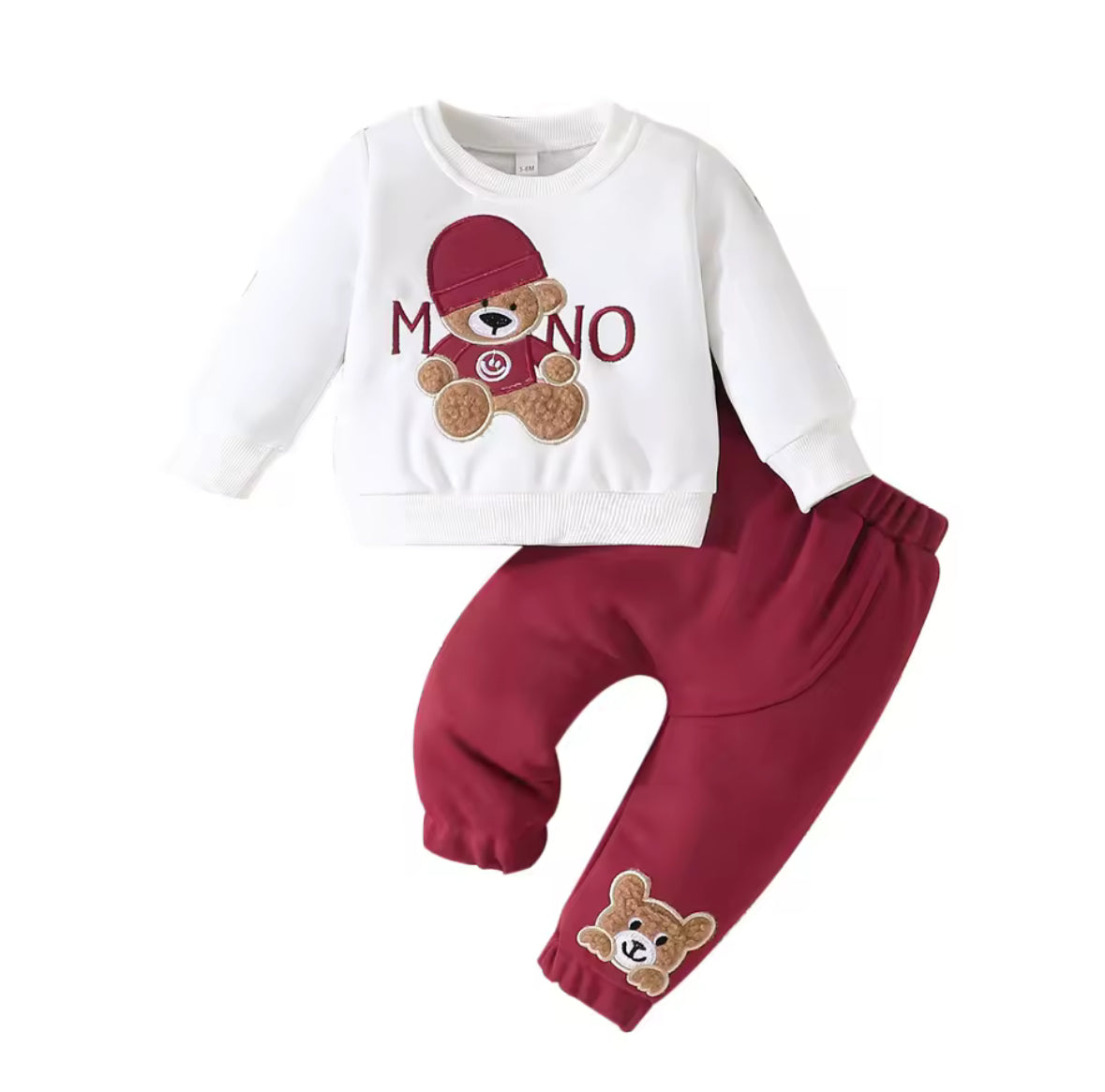 Children's outfit with white long-sleeve top and red pants featuring teddy bear designs on a white background.