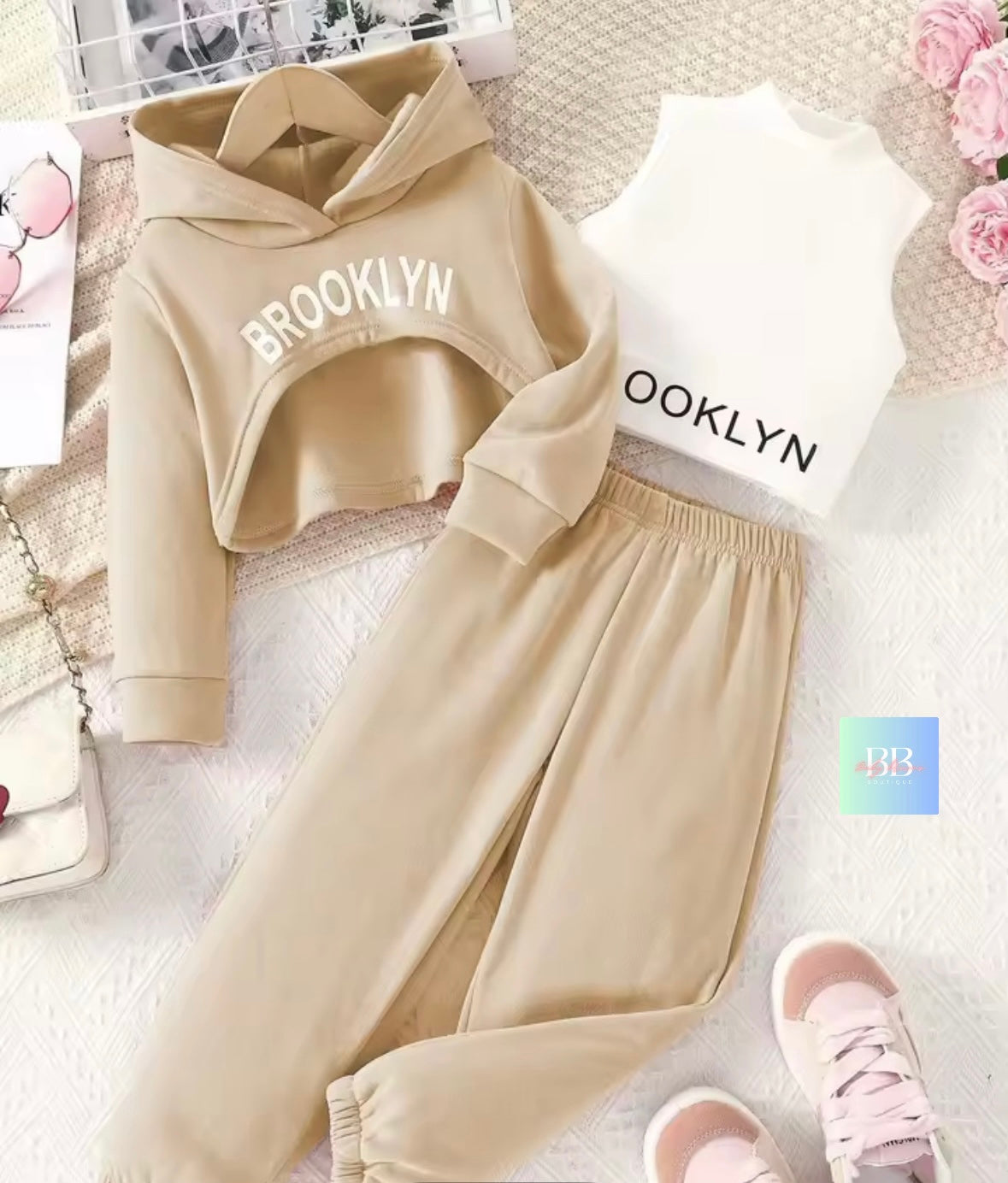 Beige hoodie and pants set with 'Brooklyn' text on a light background