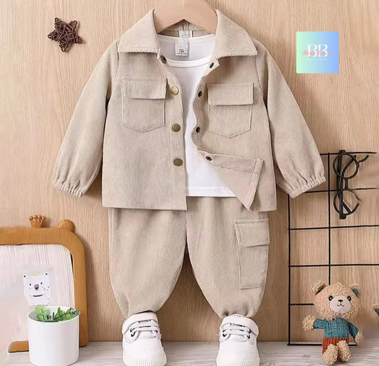 Children's beige jacket and pants set with white shirt on a wooden background