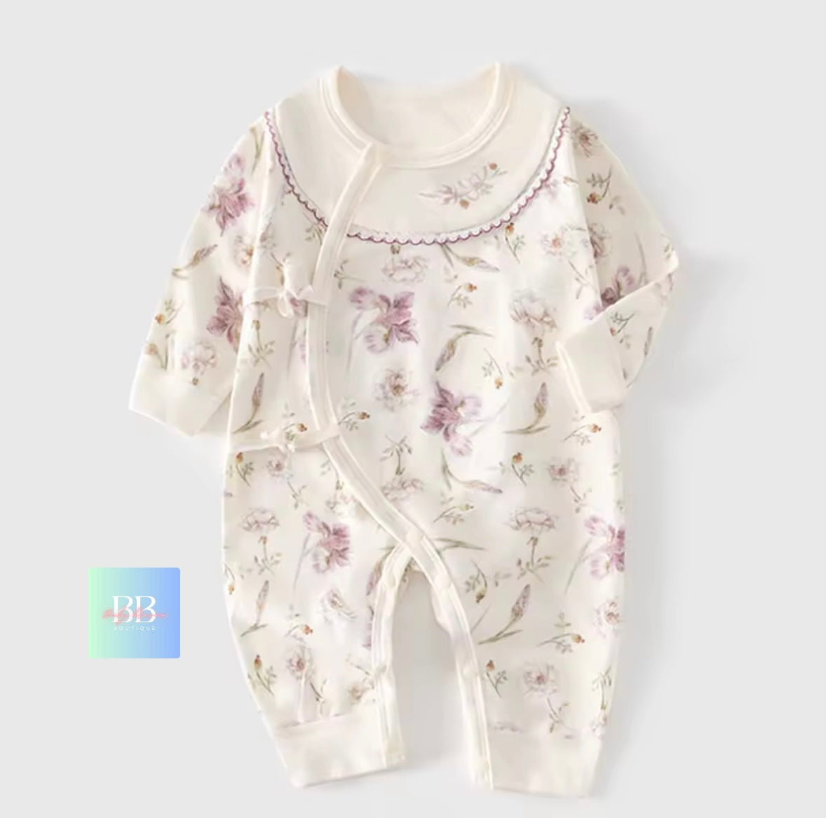 Floral-patterned baby onesie on a white background