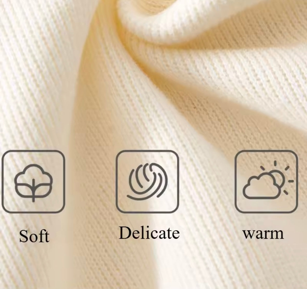 Close-up of soft fabric with icons indicating soft, delicate, and warm properties.