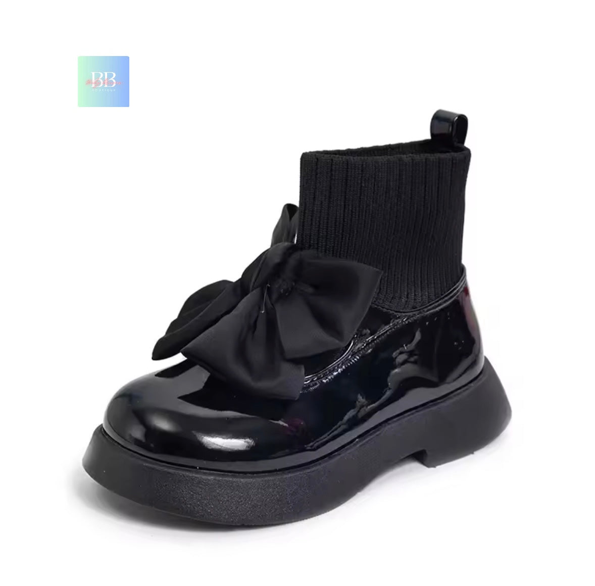 Black shiny ankle boot with a large bow on a white background