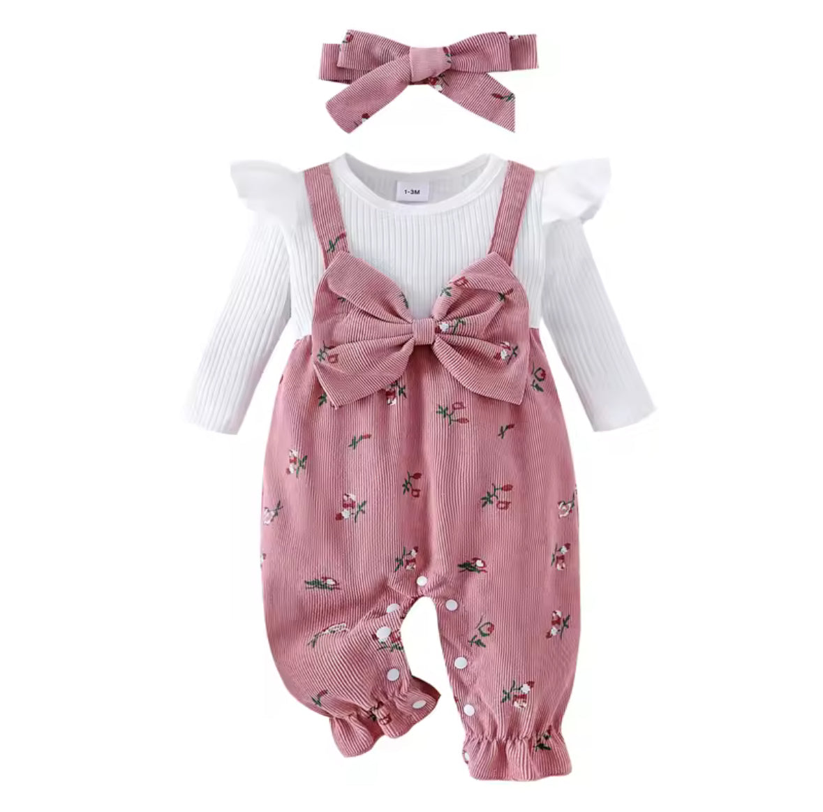 Baby outfit with pink romper, white shirt, and headband on a white background